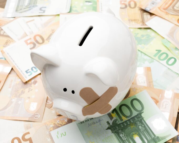 broken-piggy-bank-standing-money